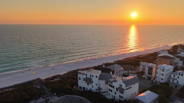 Beautiful golden sunset over Santa Rosa Beach with coastal houses, 30A, Florida, USA