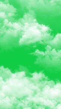 realistic clouds moving upward isolated on green background animation, real nature weather puffy cloud summer and spring day overlay vertical social media motion design element