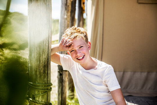 Portrait of happy boy on campsite