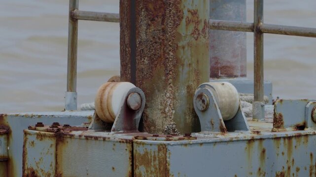 Steel wave dampening mechanism moving up an down as the waves lifting the pier above it.