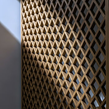 Geometric wooden screen with diamond pattern casting patterned shadows