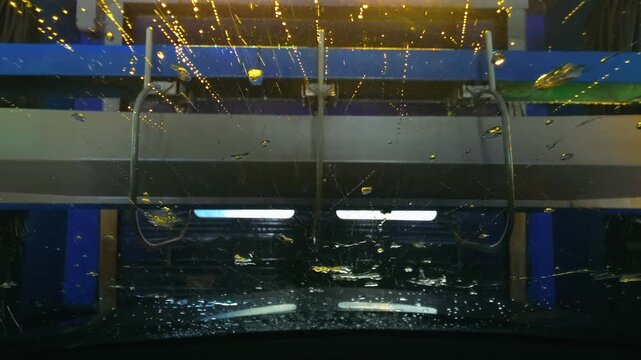 A general view from a vehicle inside an automatic car wash at a service center.