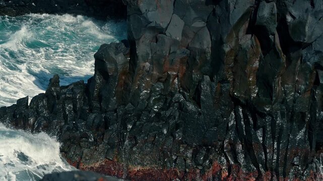 Slow motion whitewater breaks on Canary Islands basalt