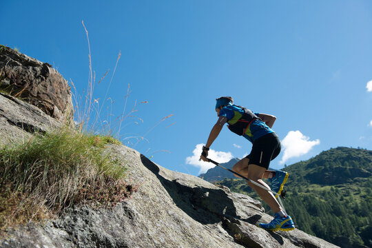 Italy, Alagna, trail runner on the move near Monte Rosa mountain massif