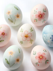 Fototapeta premium Watercolor floral Easter eggs on white background with pastel spring blossoms.