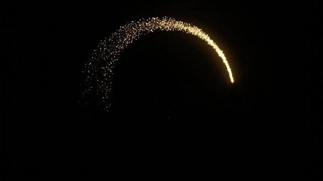 Golden Glitter Arc Light Trail Forming Elegant Sparkling Curve on Dark Background Abstract Luxury Motion Effect