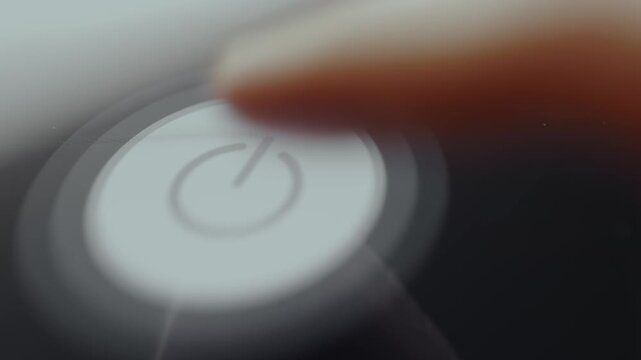 Finger taps a metal push button switch