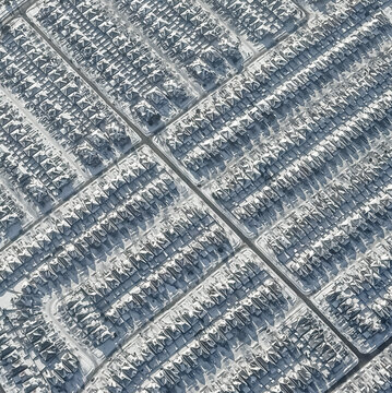 Aerial view snow covered houses in city of Toronto on winter day.