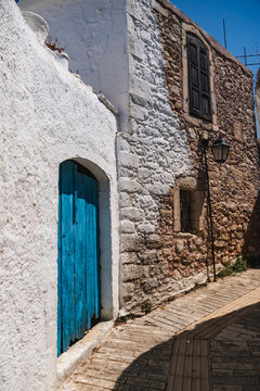 a narrow street in the small Greek town of Margarites on the island of Crete