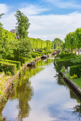Fototapeta premium Small boats at the central canal of IJlst, Netherlands