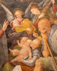 Naklejka premium VERCELLI, ITALY - JANUARY 16, 2026: The detail of renaissance fresco of Nativity - Adoration of shepherds in the church Chiesa di San Cristoforo by Gaudanzio Ferrari (1529 - 1534).