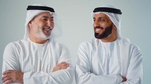 Arab emirati engineers smiling and looking at the camera