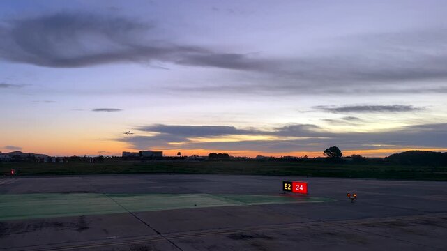 cockpit view of a jet landing at Ibiza airport runway at sunrise, RWY 24
