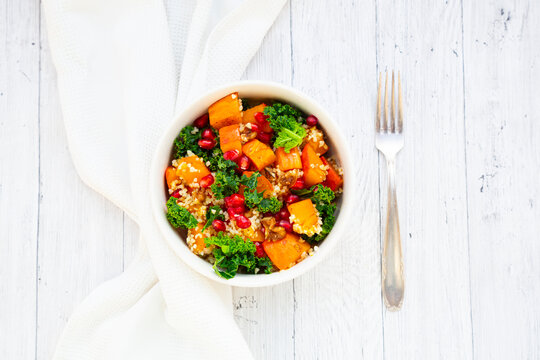Warm bulgur and Hokkaido pumpkin salad with kale and pomegranate