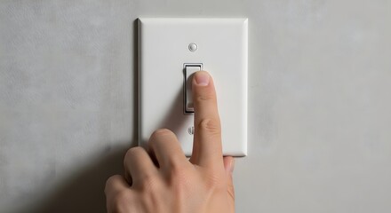 Naklejka premium Close-Up of Finger Pressing Wall Light Switch for Electrical Safety Verification
