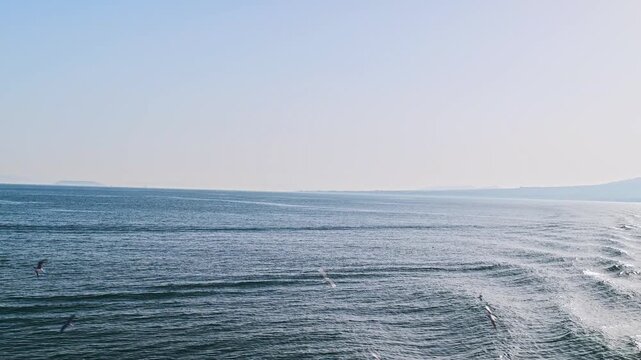 有明海を航行するフェリーからの景色 遠ざかる雲仙普賢岳と航跡
「静かな海に残る白い道。島原の山々を背に、熊本へと進む船上のひととき」
A view from a ferry sailing across the Ariake Sea: Mount Unzen and its wake receding into the distance.