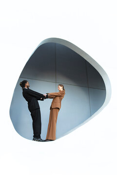 Business professionals connecting in geometric architectural setting Barcelona