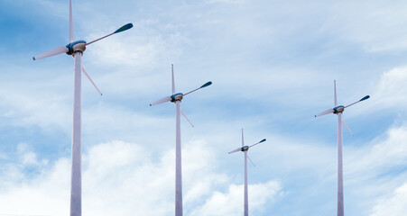 Wind mill power energy farm generator renewable sustainable field on blue sky, environment eco system technology industry ecology electricity power propeller turbine clean carbon.