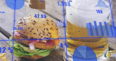 Displaying seeded burger with paper tag sitting on wooden table, with beer mug, fries, data overlay