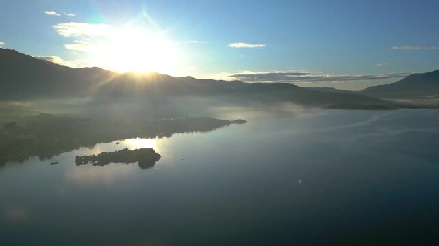 Drone footage captures the stunning natural beauty and historical significance of Bafa Lake Nature Park in Turkey. The aerial perspective showcases the serene waters of Bafa Lake nestled amidst rugged