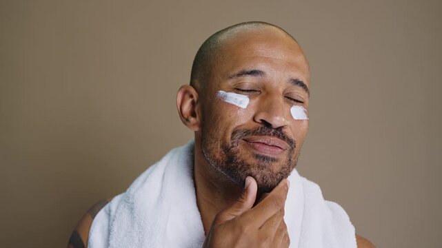 Beauty portrait of middle-aged hispanic black handsome man on colored background, concepts about beauty treatment, skincare and cosmetics for men	