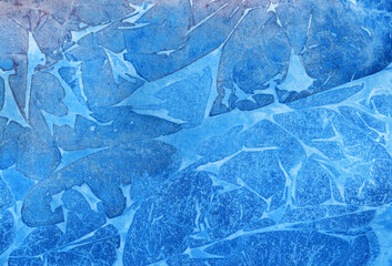 Scanned handmade watercolor background in layered blue tones, featuring organic paint textures and soft pigment transitions for creative design use.