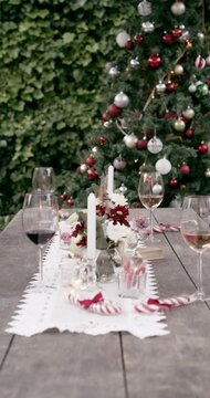 People, christmas and hands with cheers for celebration, social gathering or get together at table. Group, family or friends with glass, eggnog or toast for festive tradition or december holiday
