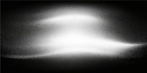 A polished silver stainless steel plate features a brushed metal texture with a shiny metallic surface and light gray reflections on a dark aluminum backdrop pattern