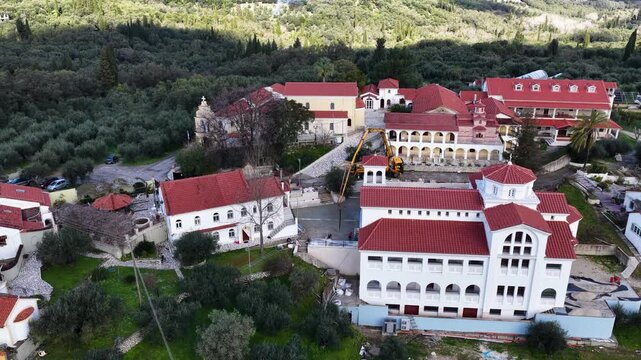 Flying Over The Historic Pantokrator Monastery In Agios Athanasios Corfu Greece Aerial Footage Of Beautiful Orthodox Nunnery Church And Monastic Buildings Surrounded By Nature Summer Holiday Scenery
