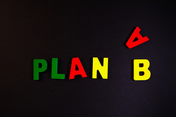 Plan B word made from colorful letters on black background. Business concept.