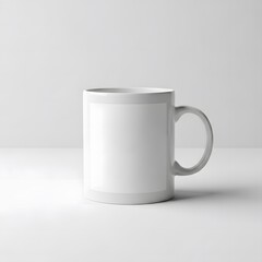 Obraz premium White ceramic mug with blank label on a clean background, mockup