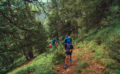 child multi day hiking in the mountains