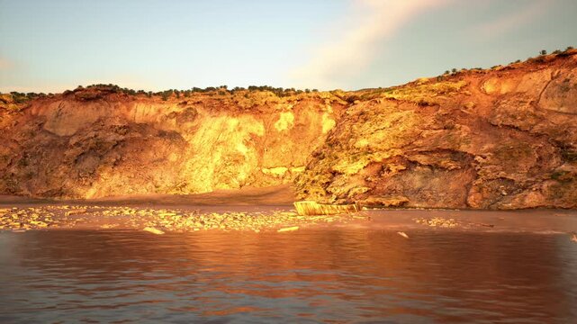 textured cliff face with warm amber tones and rippled water foreground, versatile background for design, website hero, banner or editorial layout needing