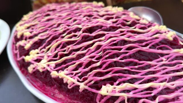 Festive layered salad with herring, beetroot and mayonnaise