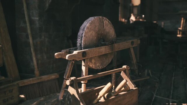 old grinding wheel and wood vise, coarse stone wheel framed by low light, focused workshop corner for sharpening, tool maintenance and edge work