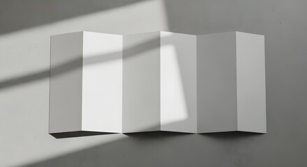 A grayscale image of a white 3d rectangular prism with sunlight casting shadows on a plain background