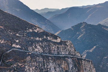 Ancient Mountain Trail Carved into Rugged Cliffs of Oman's Arabian Pen