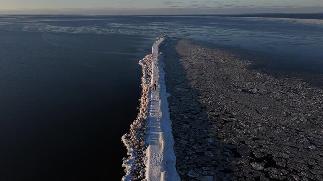 Drone View of Winter Road Leading to Lighthouse