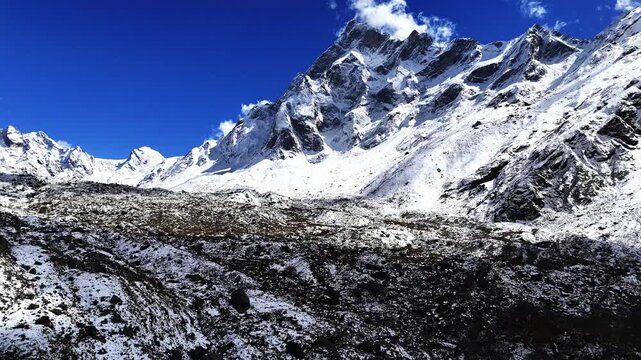 Aerial 4K drone view of snow covered Himalayan Jaundhar Glacier near Swargarohini Peak in Uttarakhand, India
