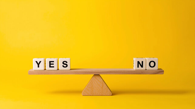 Yes and no blocks on wooden balance scale showing decision choice on yellow background