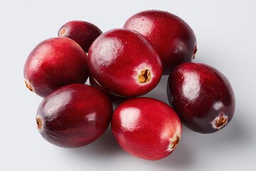 Fototapeta premium Pile Of Fresh Red Cranberries On A White Surface Highlighting Moisture And Texture With A Clean Minimalist Aesthetic