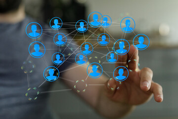 Person touching a network screen with connected people icons. Represents social media, teamwork,...