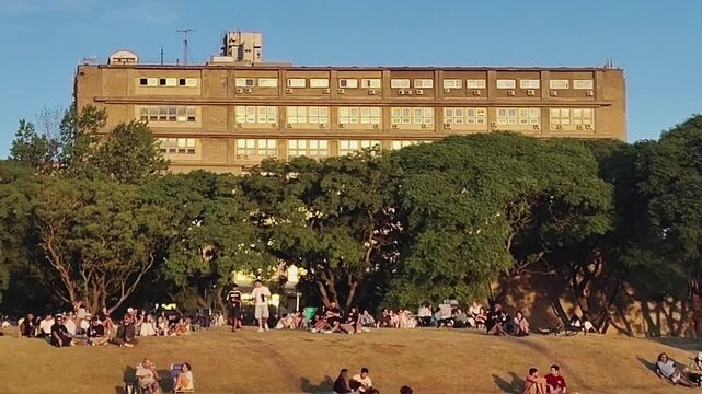 Montevideo, Uruguay: February 21 2026: A video showing a crowd of people enjoying a summer afternoon at the famous rambla de montevideo boardwalk, Montevideo city, Uruguay.