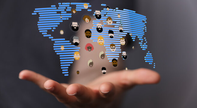 Concept of global connection and social diversity. Hand holding a digital world map with community icons.