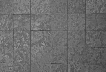 texture of grey tile fence wall. Background of gray tiled floor. Rectangular tile. stone wall pattern seams of flooring road granite surface with marmor backdrop building brick exterior interior