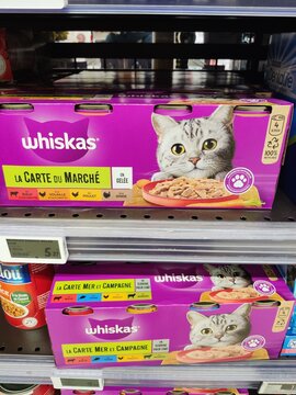 Saujon, France - January 24, 2026: Intermarche. Whiskas cat food packaging featuring a gray tabby cat on a vibrant purple box displayed on a supermarket shelf