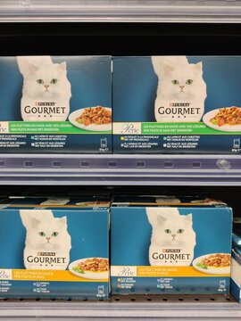 Saujon, France - January 24, 2026: Intermarche. Gourmet cat food boxes featuring a white cat image on packaging displayed on a supermarket shelf in a retail environment