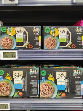 Saujon, France - January 24, 2026: Intermarche. Sheba cat food packaging displayed on supermarket shelf, featuring multiple boxes with visible ingredients and nutritional information