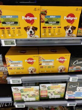 Saujon, France - January 24, 2026: Intermarche. Pedigree dog food boxes displayed on a supermarket shelf, featuring adult and puppy formulas with colorful packaging and nutritional information