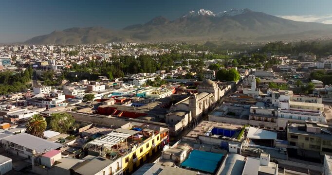 Santa Catalina monastery in Arequipa with snowy mountain peak in back. Aerial